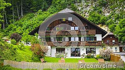 Beautiful Alps landscape with green mountains, valley, houses and forest Stock Photo