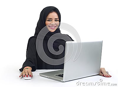 Beautiful Arabian business woman working on her laptop Stock Photo
