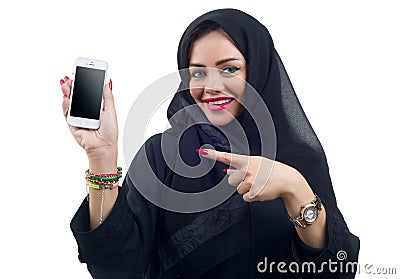 Beautiful Arabian model holding a cell phone on an isolated background Stock Photo