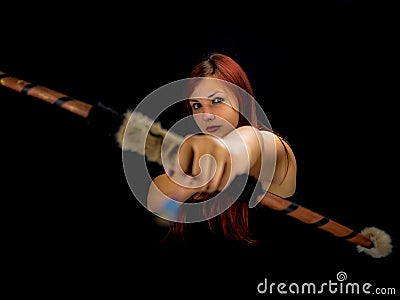 Beautiful archery woman aiming, black background Stock Photo