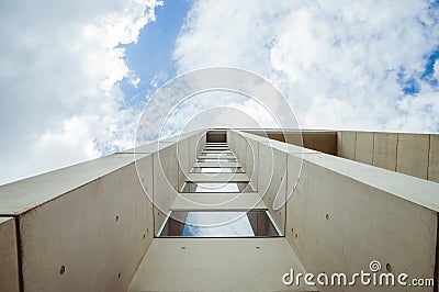 Beautiful architecture details of a modern building of concret an fiberglass, with a view on a blue cloudy sky Editorial Stock Photo