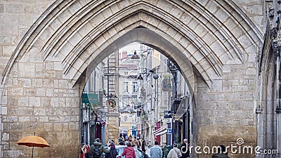 Beautiful archway in a bustling street in Bordeaux Editorial Stock Photo