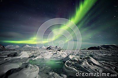 Beautiful Arctic fjord landscape with Northern Lights - Spitsbergen, Svalbard Stock Photo