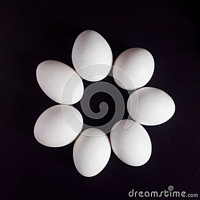 Beautiful arrangement of eggs on black Stock Photo