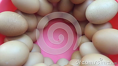 3 Beautiful arrangement of eggs in a pink basin Stock Photo