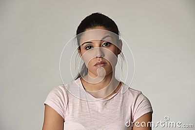 Beautiful arrogant and moody latin woman showing negative feeling and contempt facial expression Stock Photo