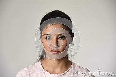 Beautiful arrogant and moody latina woman showing negative feeling and contempt facial expression Stock Photo