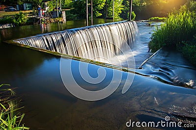 A beautiful artificial waterfall for swimming in the summer in the city of Satanov Stock Photo
