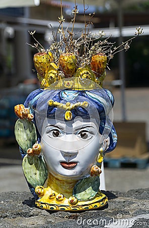 Beautiful artistic ceramic female flower pot in sicily island Editorial Stock Photo