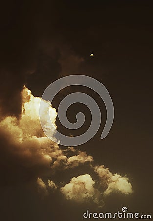 An artistic view of evening sky with clouds and moon Stock Photo