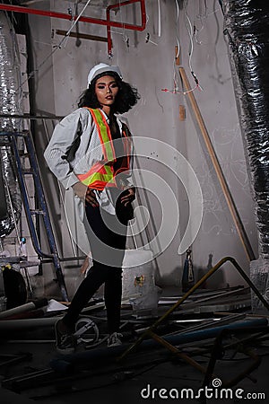 Beautiful Asian Architect Engineer woman in white hard hat Stock Photo
