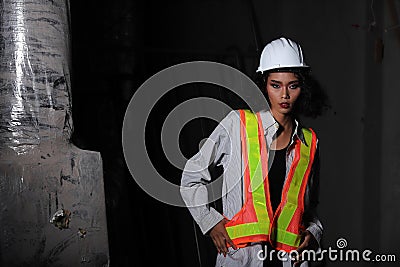 Beautiful Asian Architect Engineer woman in white hard hat Stock Photo