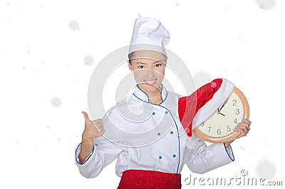 Beautiful asian chef with clock and Christmas hat Stock Photo