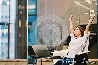 Beautiful Asian girl celebrate with laptop, hands stretch or finish work success pose Stock Photo