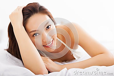 Beautiful asian woman relaxing on the bed Stock Photo