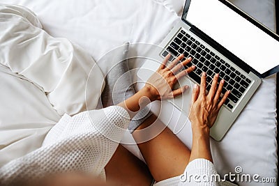 Beautiful asian woman using computer with morning light. Stock Photo