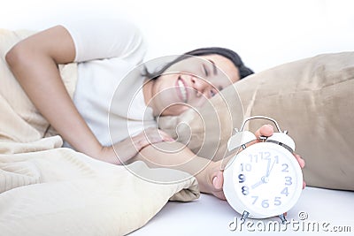 Beautiful asian woman waking up in her bed and she smiling adequate rest, sleeping concept Stock Photo