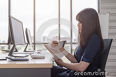 Beautiful staff are happy at the office desk Stock Photo