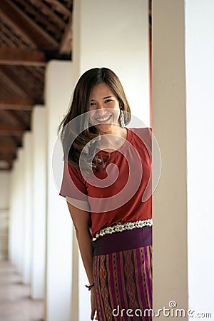 Beautiful Asian woman by wearing sarong looking at camera on the blurred background Stock Photo