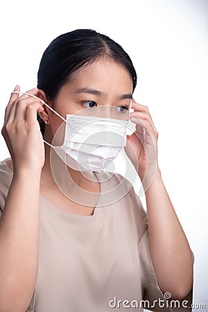 Beautiful asian young woman with disposable face mask Stock Photo