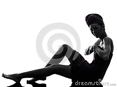 Beautiful asian young woman wrapped towel sitting on floor silh Stock Photo