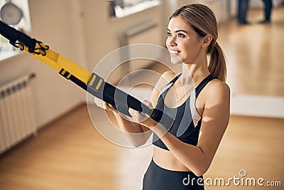 Beautiful athletic woman performing an exercise for arms Stock Photo