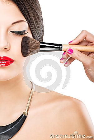 Beautiful attractive woman with half face, luxury makeup brush of his face Stock Photo