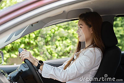 Beautiful attractive young woman smile in casual sitting in car Stock Photo