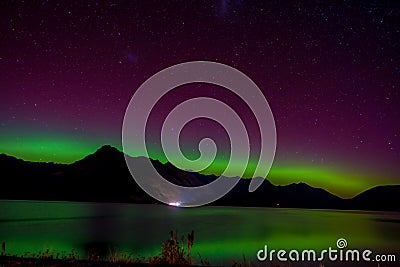 Beautiful Aurora Australis and milky way over Lake Wakatipu, Kinloch, New Zealand South Island Stock Photo