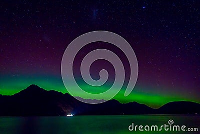 Beautiful Aurora Australis and milky way over Lake Wakatipu, Kinloch, New Zealand South Island Stock Photo