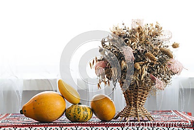 Beautiful autumn composition of basket with healing herbs dried Stock Photo