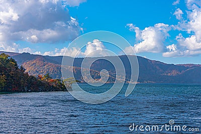 Beautiful autumn foliage scenery landscapes. View from Lake Towada sightseeing Cruise ship Stock Photo