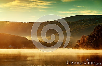 Beautiful autumn landscape, the lake in the morning fog Stock Photo