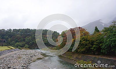 Beautiful autumn trees along the river of Shirakawa village Stock Photo