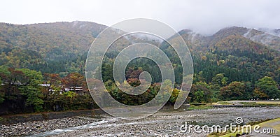 Beautiful autumn trees along the river of Shirakawa village Stock Photo