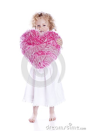 Beautiful baby with heart pink pillow Stock Photo