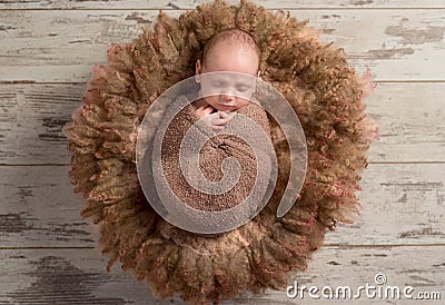 Beautiful baby sleeping sweet on fluffy round cot Stock Photo