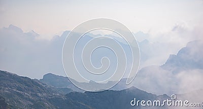 Beautiful background with blue ridge in hazy mountains. Julian Alps Stock Photo