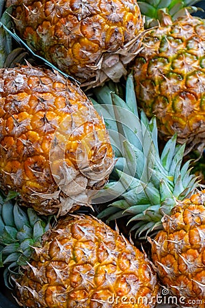Beautiful background of many pineapples. Tropical fruits Stock Photo