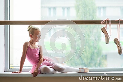 Beautiful ballet girl in pink leotard. Stock Photo