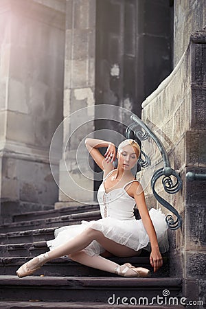 Beautiful ballet woman on stairs Stock Photo