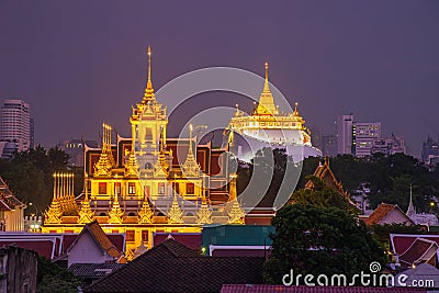 Beautiful Bangkok cityscape at twilight with Loha Prasat Wat Ratchanatda and Golden Mountain pagoda during twilight time, Bangkok Stock Photo