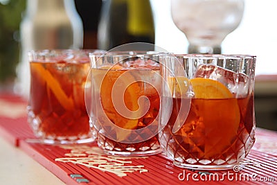 Beautiful bar glasses with alcoholic cocktail and citrus inside Stock Photo