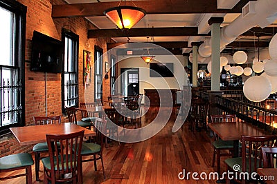 Beautiful bar, with warm wood and brick, welcomes patrons in for a visit,Harvey's Resaurant and Bar,Saratoga,New York,2015 Editorial Stock Photo