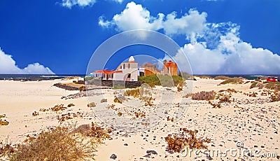 Beautiful beach coast landscape, sand dunes, colorful seaside boutique style vacation home cottage, blue summer sky - El Cotillo, Stock Photo