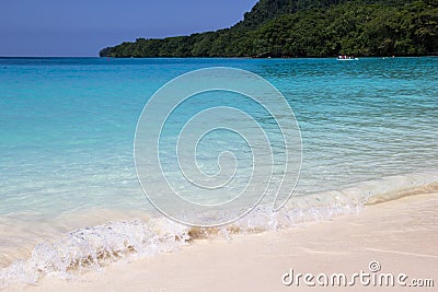 Beautiful beach with pristine turquoise water in Champagne Bay island of Papua new Guinea Stock Photo