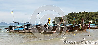 Beautiful beach with sea views and a traditional Thai fishing boat.Beautiful beach with tropical trees with a wave of the sea and Editorial Stock Photo