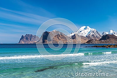 Mountain chain with snow in the background. From Myrland beach in Lofoten - Norway. Stock Photo