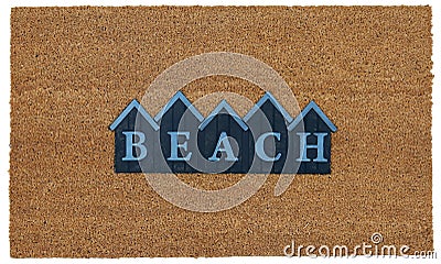 Beautiful beige and blue zute / coir Outdoor Door mat with BEACH text in mountain style Stock Photo