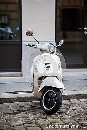Beautiful beige Piaggio Vespa scooter parked in central Vienna Editorial Stock Photo